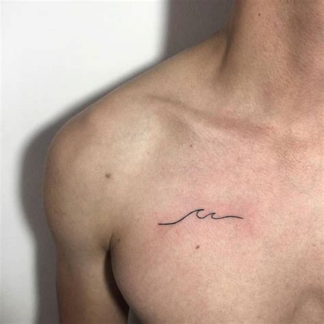 tattoo male chest|minimalist chest tattoo.